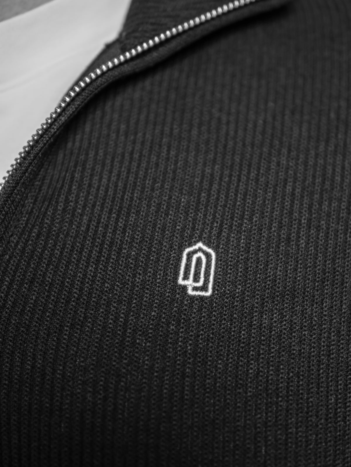 Grey Limited Edition Quarter Zip Thobe, embroidered logo close-up