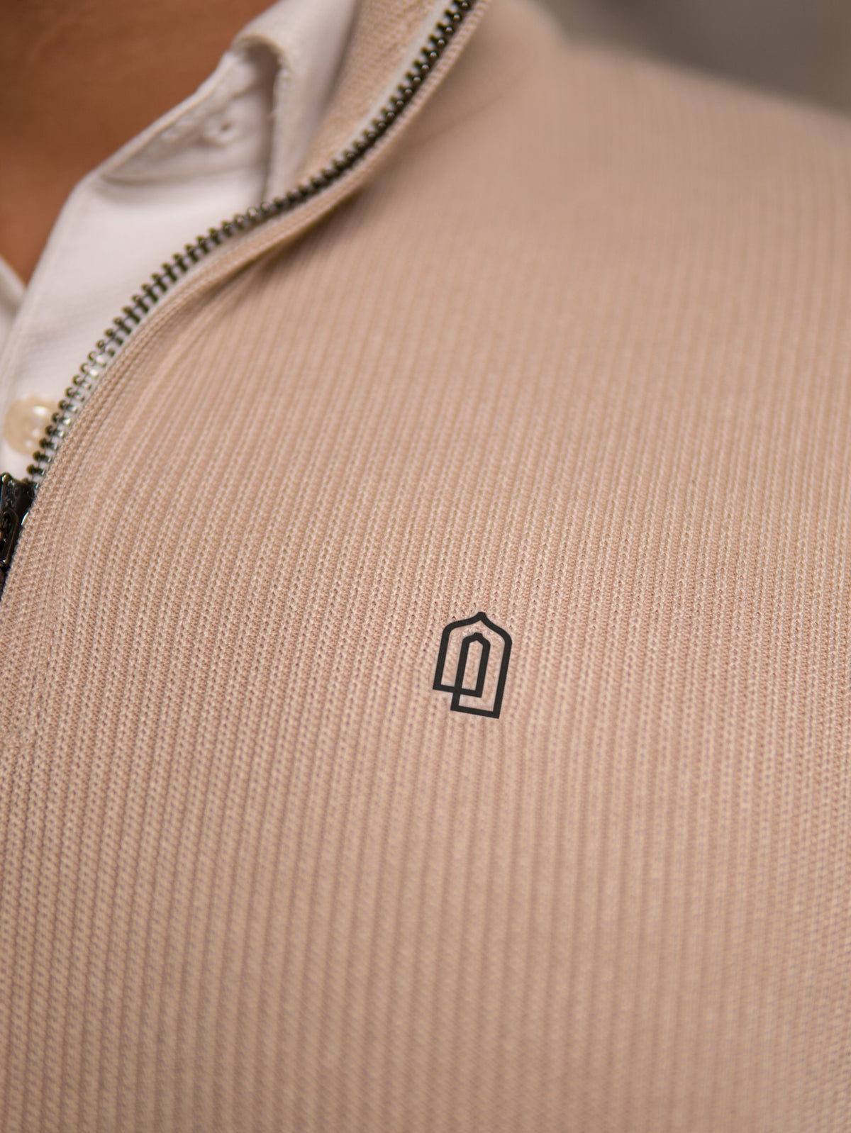 Sandstone Signature Quarter Zip Thobe, embroidered logo close-up